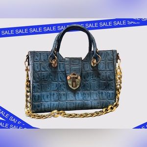 Beautiful blue faux leather croc belly print bag!